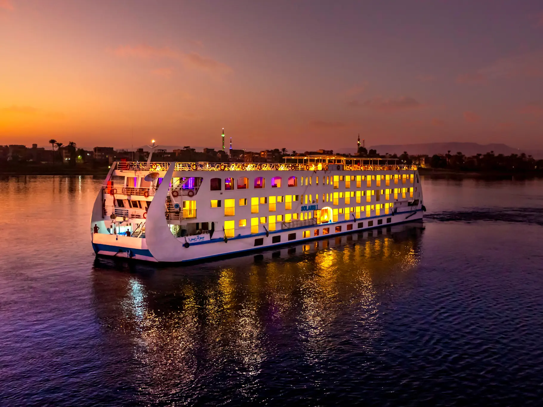 Luxury 5-star cruise ship sailing the Nile River at dusk