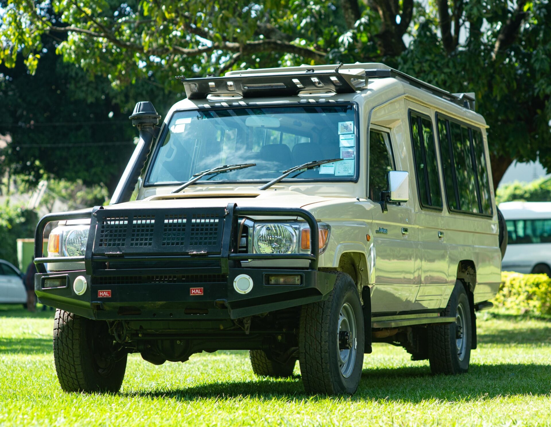 4x4 Land Cruiser parked at a Safari Rally spectator area in the Rift Valley